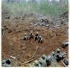 Troops in a bomb crater