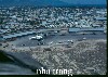 Civilian side of airfield with C-46's & Air America helicopter