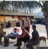 from right Herman "Rap" Brown, seated next to him unk. standing Toten, company armorer,  and seated in lawnchair Jim Moore