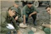 Checking out an unexploded satchel charge!  (l) Stallion 509 Crew Chief Danny McDanial, 2nd from left is Paul Abel, CC for Stallion 953 & later 920.  Second from right  PFC Daniel Robledo